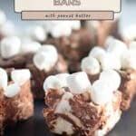 Decadent Rocky Road Bars with gooey marshmallows and rich chocolate rest on a slate, text reads "Rocky Road Bars with peanut butter".