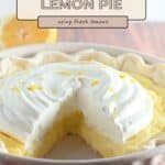 A classic lemon cream pie with a tangy lemon filling and whipped topping, garnished with fresh lemon zest and a lemon half in the background.