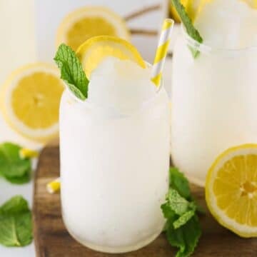 A lemonade slushie in a clear glass.