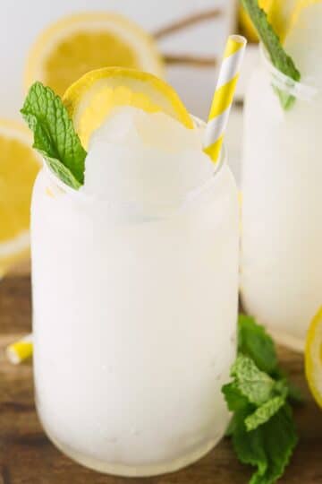 A lemonade slushie in a clear glass.