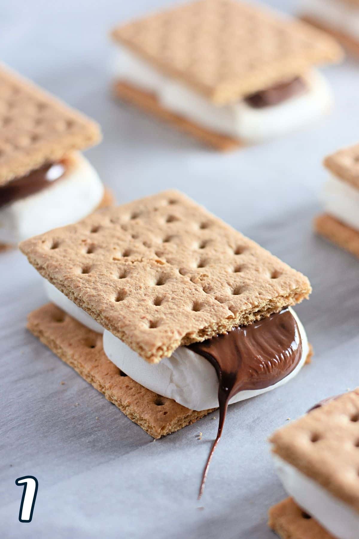 Graham crackers filled with toasted marshmallow and melting chocolate. 
