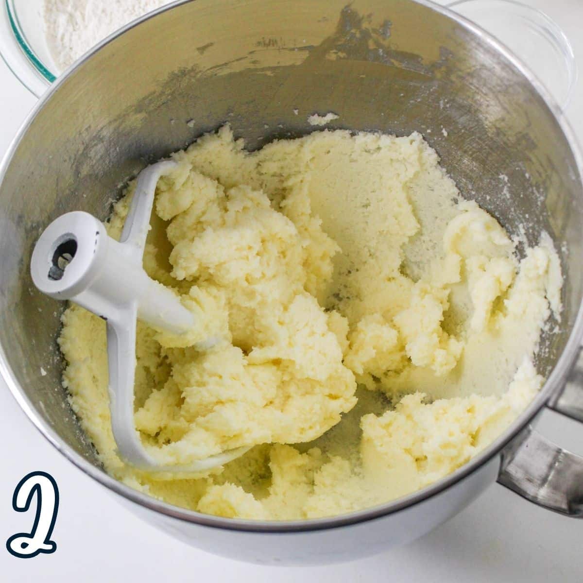 Whipped butter and sugar in a mixing bowl. 