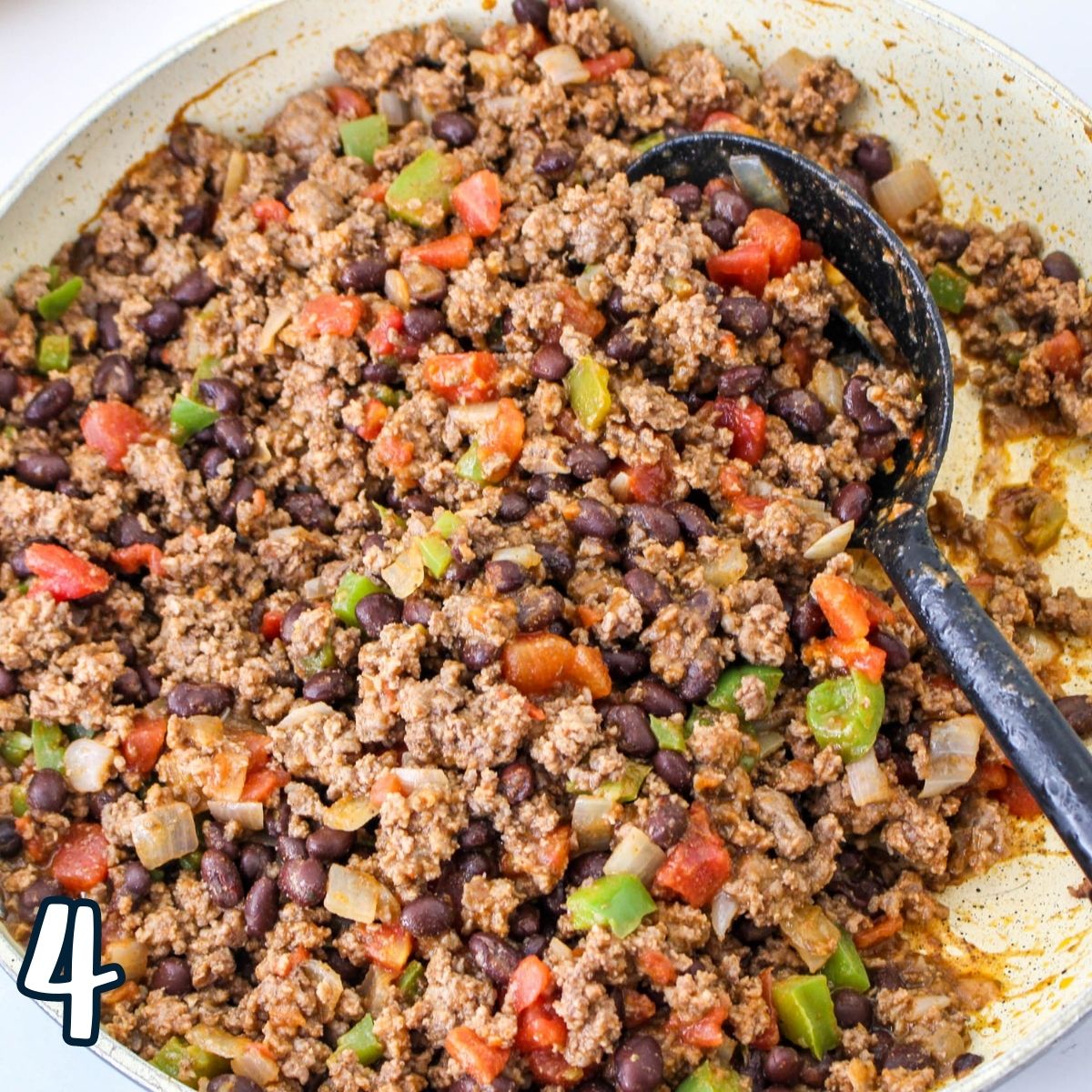Cooked taco meat in a skillet. 