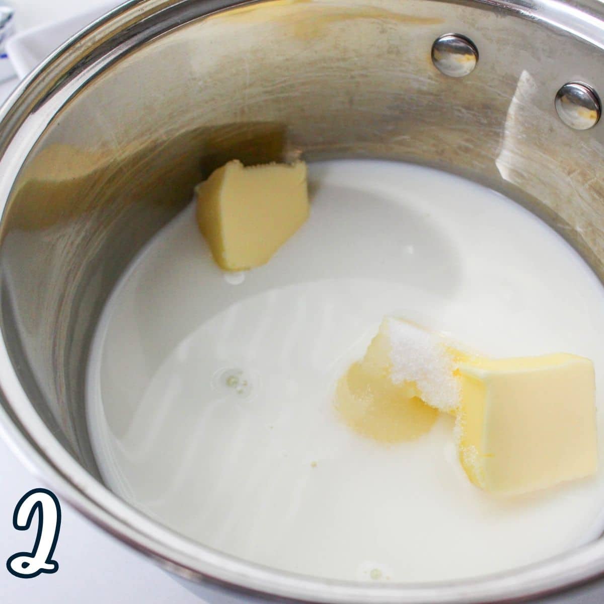 Milk, sugar, and butter in a saucepan. 