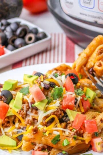 A plate of taco flavored pasta on a white plate.
