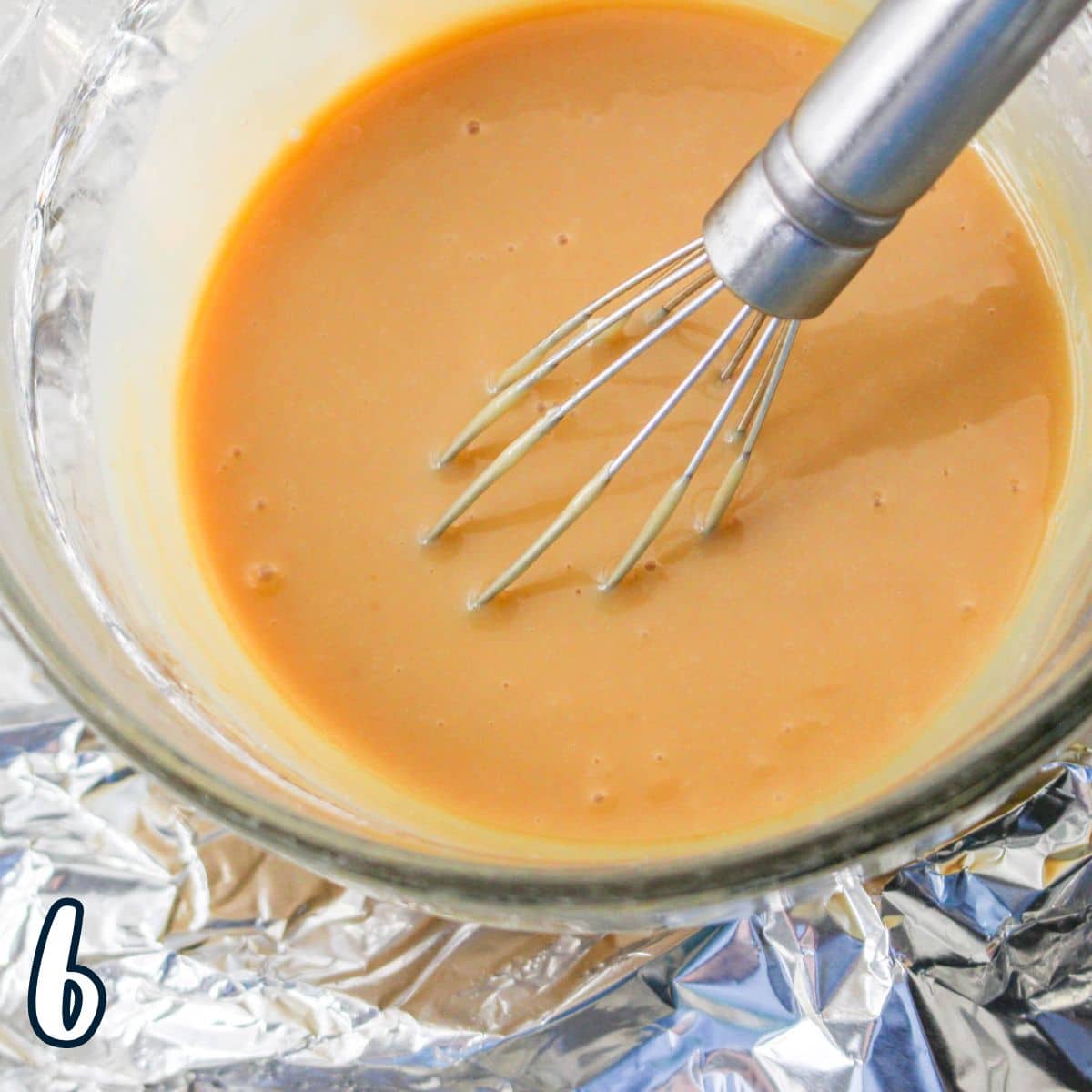 Just cooked Dulce de Leche in a glass bowl with a wire whisk. 