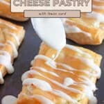 Rectangular Lemon Cream Cheese Pastry treats are topped with white icing, delicately drizzled on with a spoon for a sweet finish.
