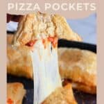 A hand pulls apart a cheesy, golden homemade pizza pocket with melted cheese stretching.