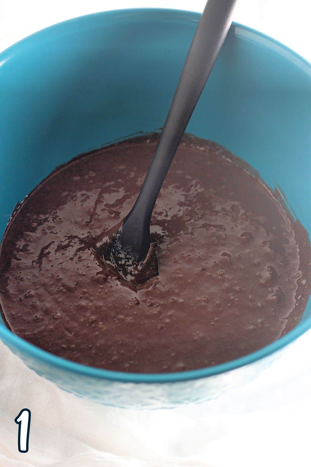Mixed chocolate cake batter in a mixing bowl. 
