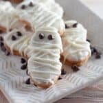 Ghost and Mummy decorated cookies on a white platter.