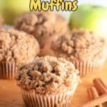 Apple cinnamon muffins on a cutting board, fresh and delicious.