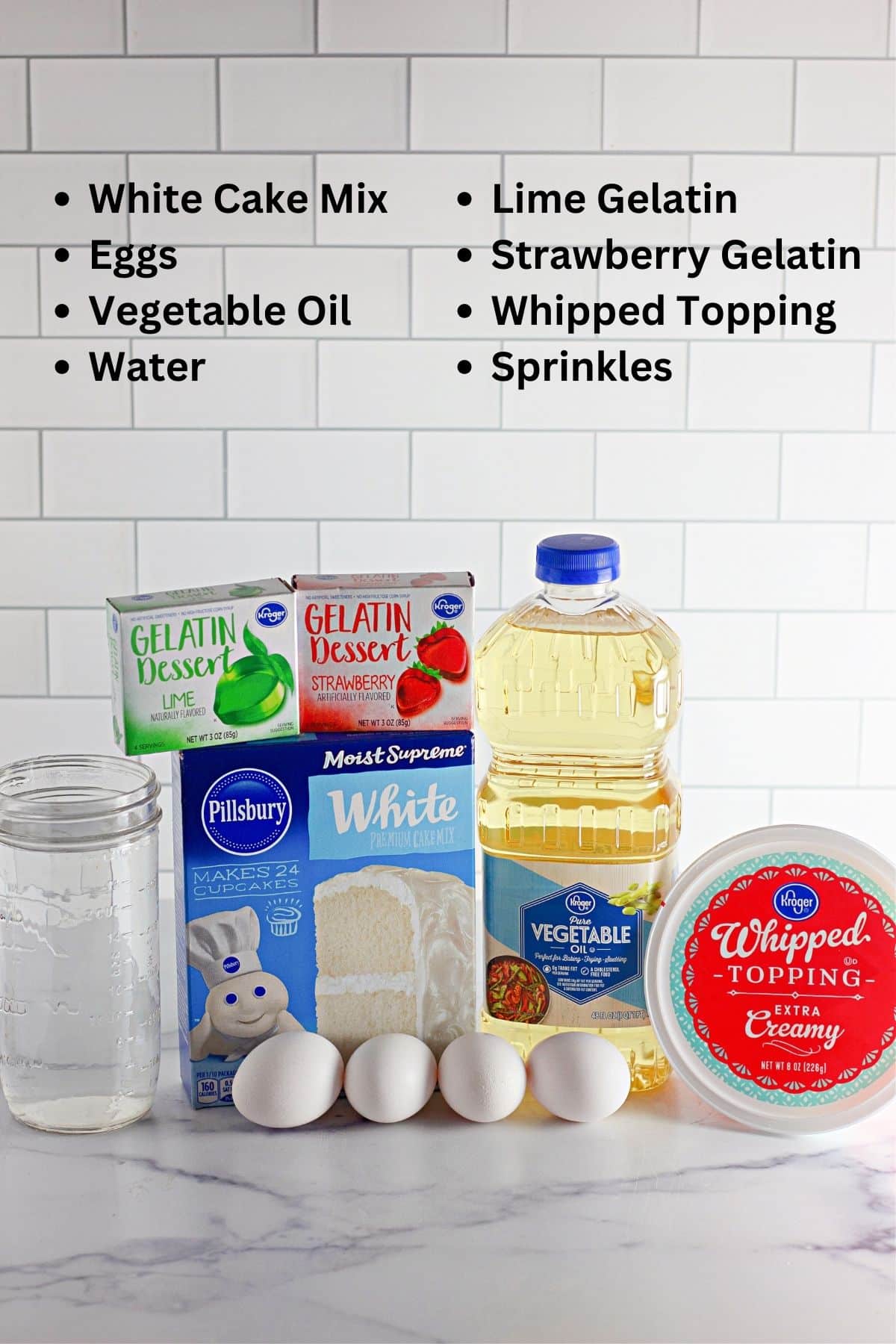 The ingredients for a holiday poke cake are shown on a counter.