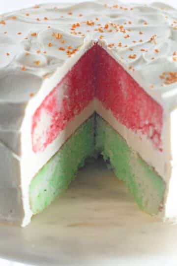 A cake with a slice taken out of it.