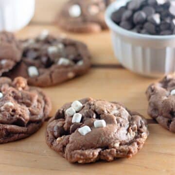 Hot cocoa cookies on a wooden table.