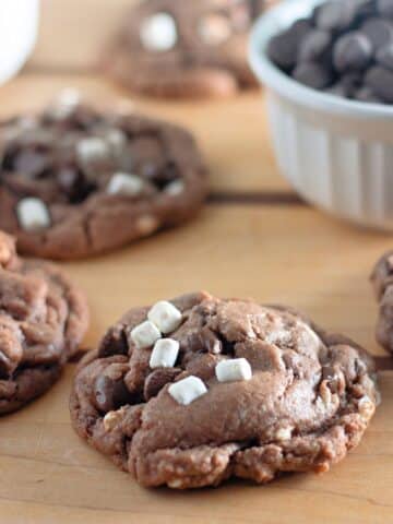 Hot cocoa cookies on a wooden table.