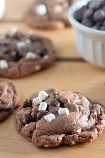 Hot cocoa cookies on a wooden table.