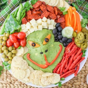 A plate with a grinch shaped dip on it.
