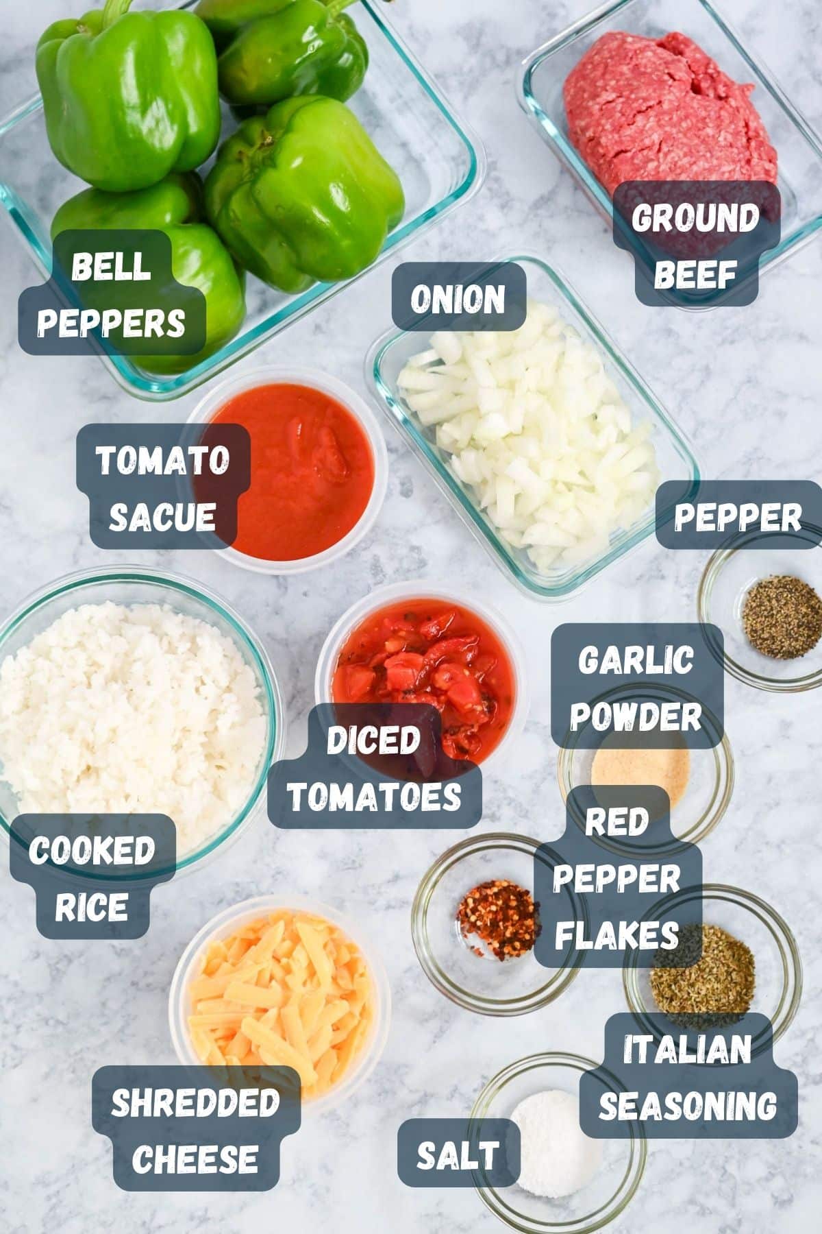 Ingredients for stuffed bell peppers, including bell peppers, ground beef, onion, tomato sauce, cooked rice, and spices.