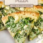 A slice of spinach feta pizza on a plate, topped with melted cheese and fresh herbs, with more delicious slices in the background.