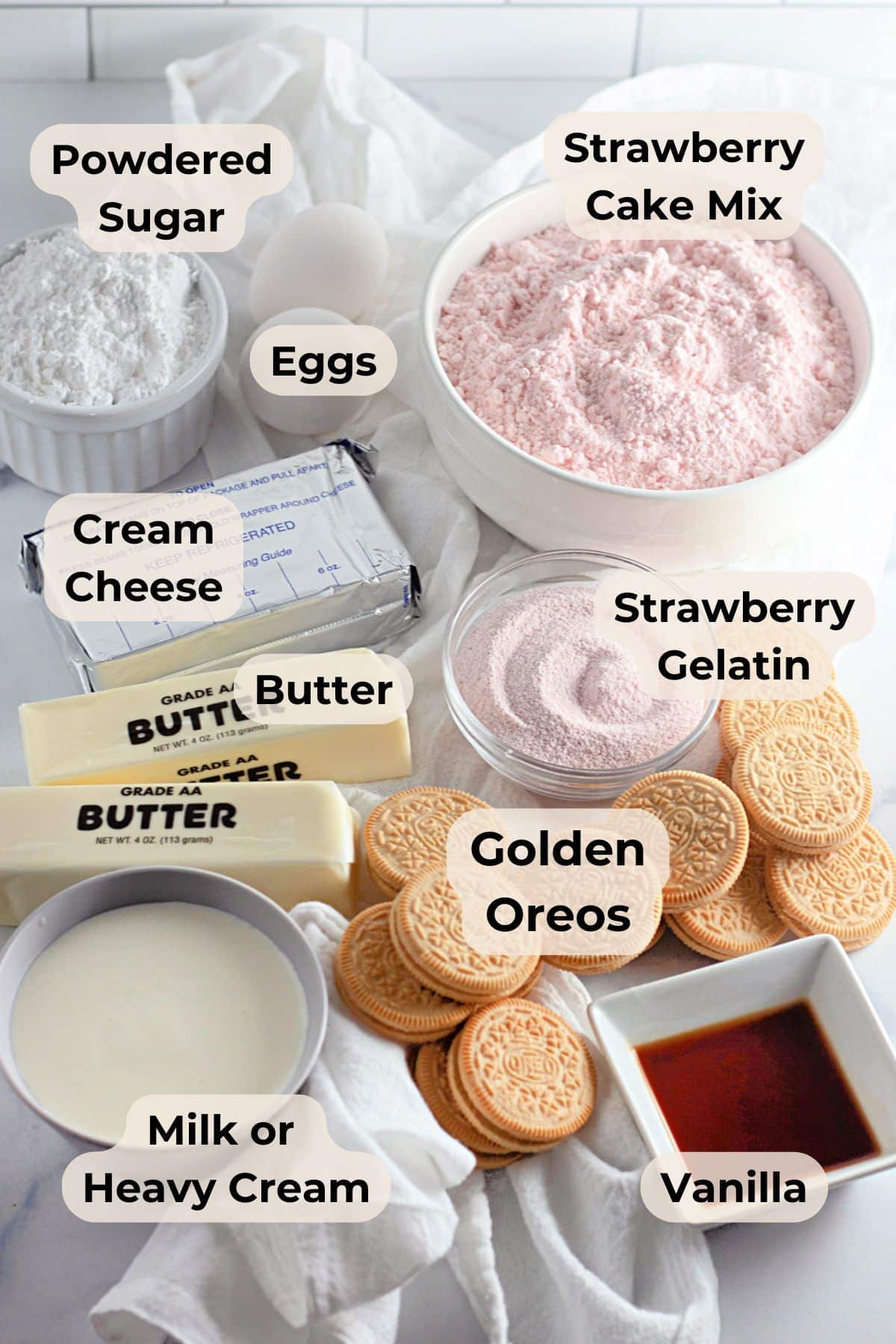 Baking ingredients labeled: powdered sugar, eggs, strawberry cake mix, cream cheese, butter, gelatin, Oreos, cream, vanilla—perfect for whipping up irresistible strawberry crunch bars.