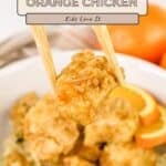 Chopsticks hold a piece of Air Fryer Orange Chicken above a bowl; text reads "Air Fryer Orange Chicken.