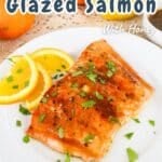 A delectable plate of orange glazed salmon, artfully garnished with fresh herbs and vibrant orange slices, accentuated by inviting recipe text overlays.