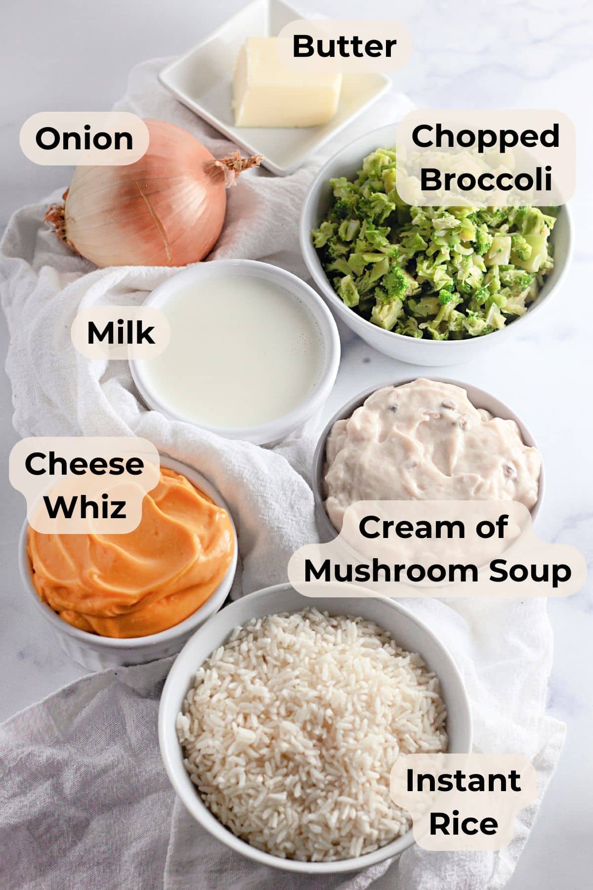 Create a Cheesy broccoli rice casserole with onion, milk, Cheese Whiz, butter, chopped broccoli, mushroom soup, and instant rice for a creamy and satisfying dish.
