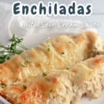 A plate of Chicken Enchiladas with Sour Cream Sauce showcases two cheesy delights, garnished with parsley.