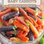 A bowl of honey roasted orange, purple, and yellow baby carrots garnished with chopped parsley.