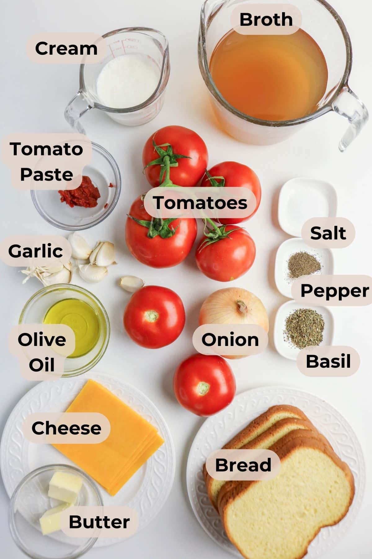 Ingredients for tomato soup and grilled cheese: tomatoes, broth, cream, bread, cheese, butter, onion, and seasonings.
