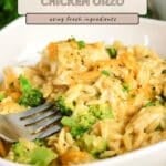A bowl of Broccoli Cheddar Chicken Orzo with a fork, garnished with fresh herbs and black pepper.