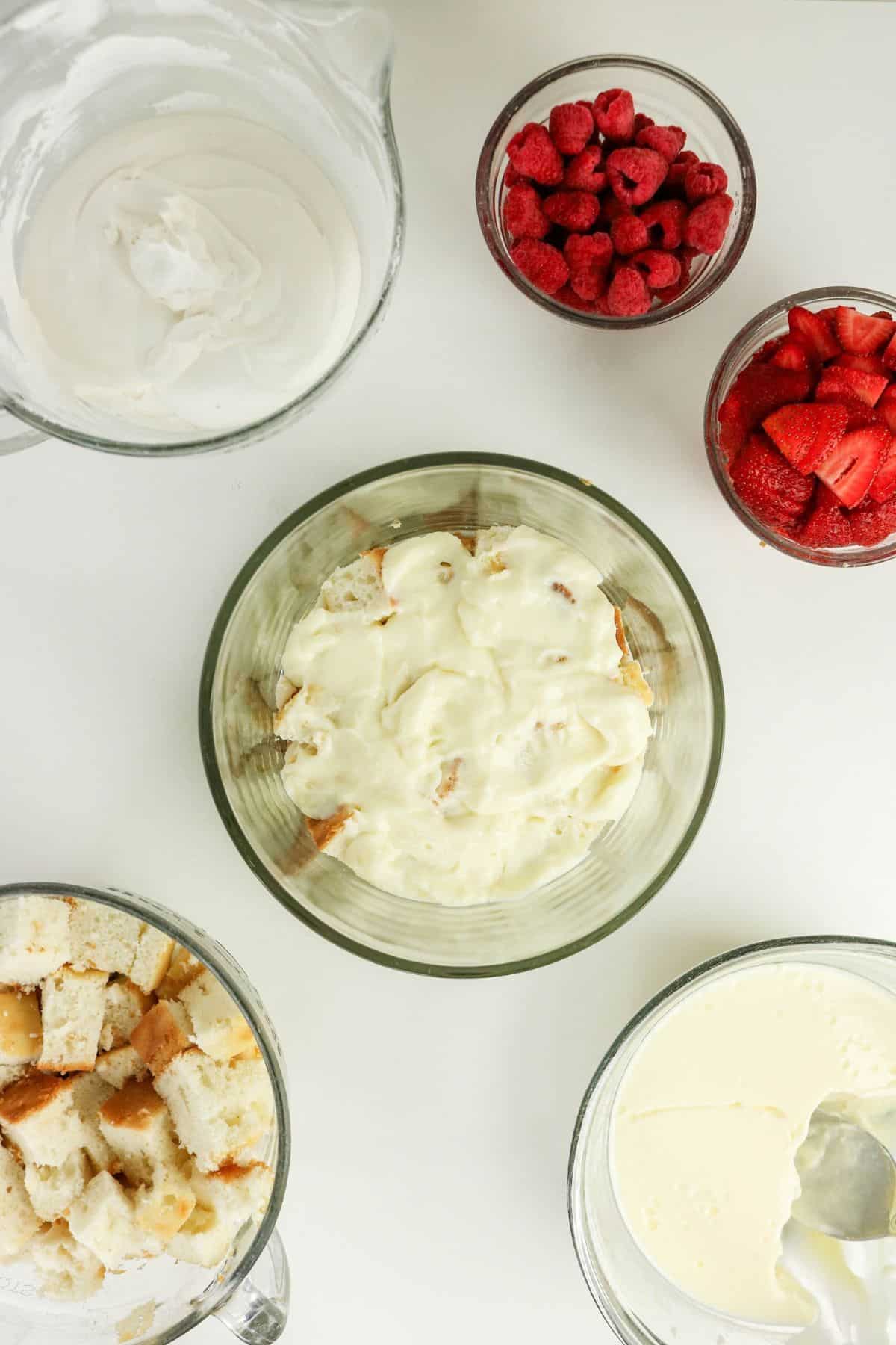 Thickened white chocolate pudding spread over the layer of cake cubes.