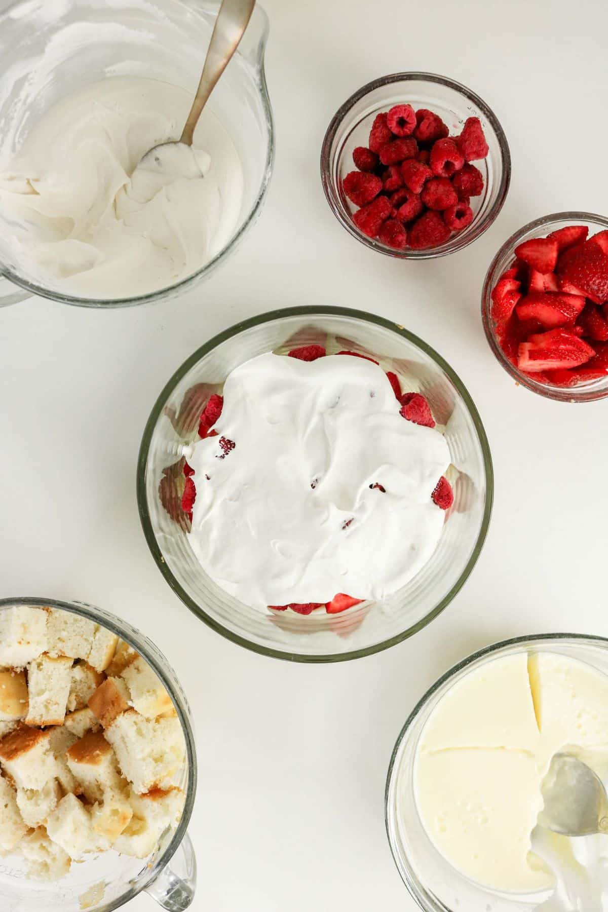 Whipped topping spread over the berry layer.